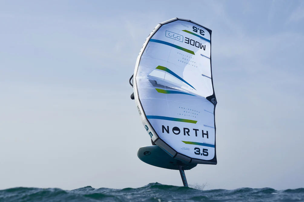 North Mode Pro 2026 kite soaring over the water, showcasing its lightweight design and aerodynamic features.
